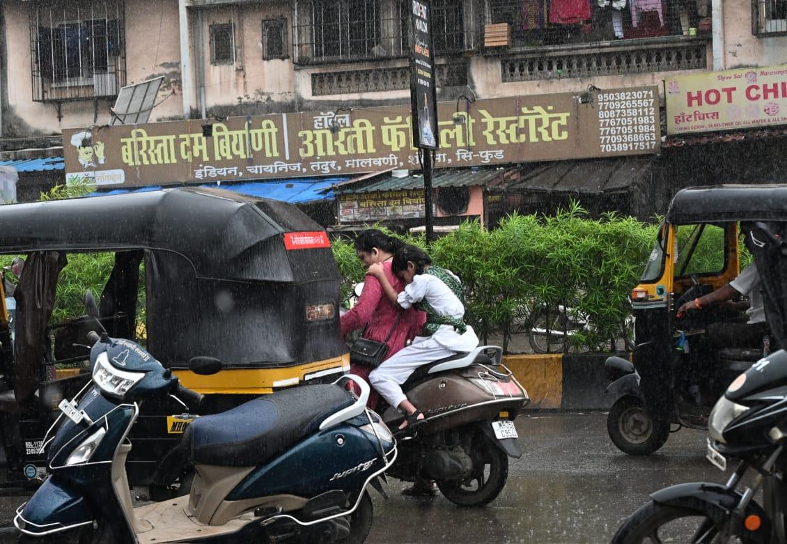 Unexpected showers caught locals off guard as they ventured without umbrellas 
